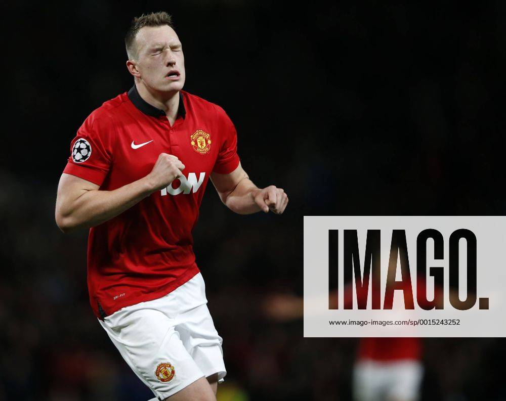 Phil Jones of Manchester United celebrates scoring during the UEFA Champions League Group A match between Manchester United and Shakhtar Donetsk at Old Trafford Stadium in Manchester, Britain on Dec. 10, 2013. Manchester United won 1-0. (Xinhua Wang Lili) (SP)BRITAIN-MANCHESTER-SOCCER-UEFA CHAMPIONS LEAGUE-GROUP A-MAN UTD VS DONETSK