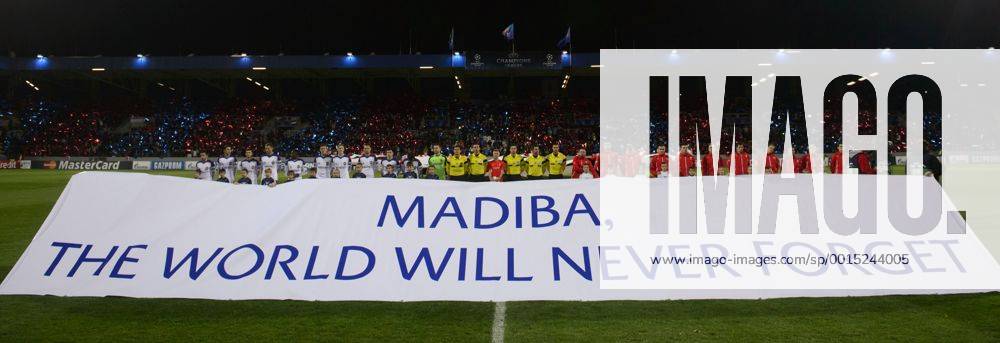 CSKA Moscow players (left) and Pilsen players hold a transparent which reads MADIBA, THE WORLD WILL NEVER FORGET to pay tribute to deceased Nelson Mandela in Pilsen, Czech Republic, on December 10, 2013, ahead of the 6th round Champions League match FC Viktoria Plzen vs CSKA Moscow. (CTKxPhoto MichalxKamaryt) CTKPhotoP201312100918301 kmt 4