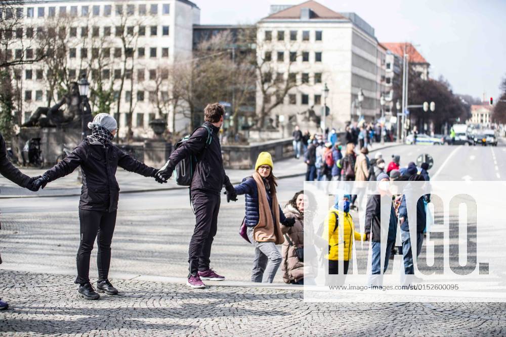 As part of near-daily demonstrations against the war in Ukraine, residents of Munich, Germany organized a human chain that spanned between the Russian and the Ukrainian Consulates. Munich Germany - ZUMAb160 20220305_zbp_b160_024