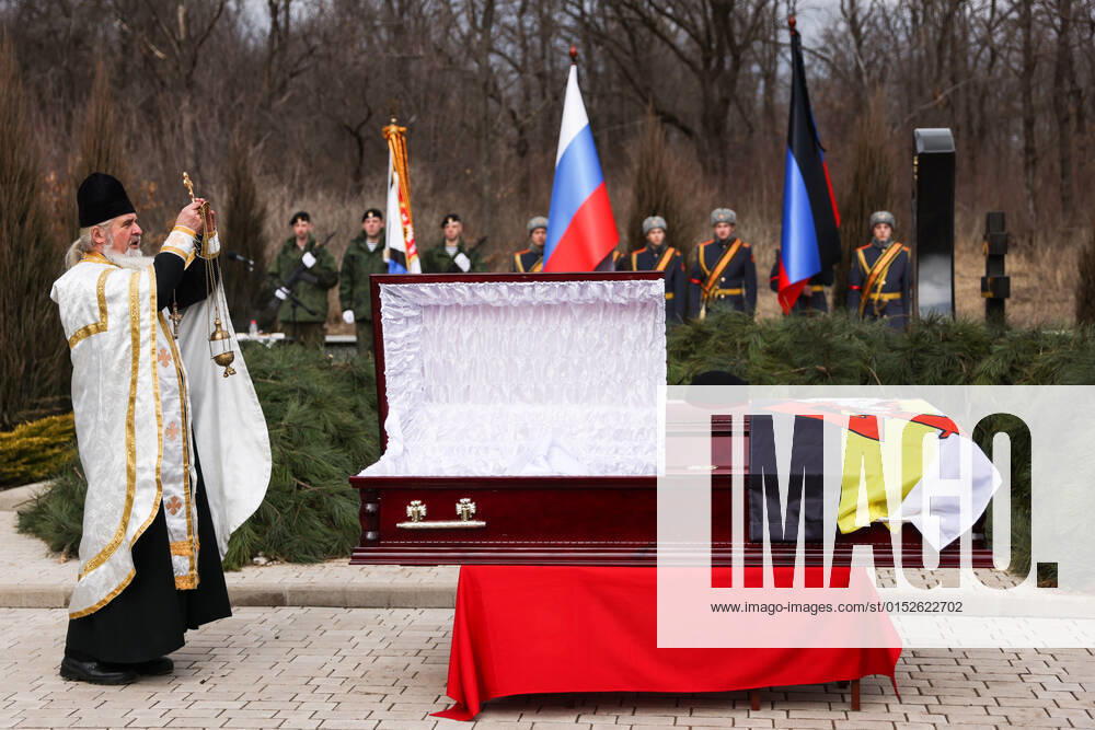DONETSK, DONETSK PEOPLE S REPUBLIC - MARCH 7, 2022: A priests attends Sparta Battalion commander Vladimir Zhoga s funeral Donetskoye More Donetsk Sea Cemetery. Zhoga was killed in action in Volnovakha on March 5 while trying to secure a safe passage out for civilians. Sergei Bobylev TASS TS126E7E