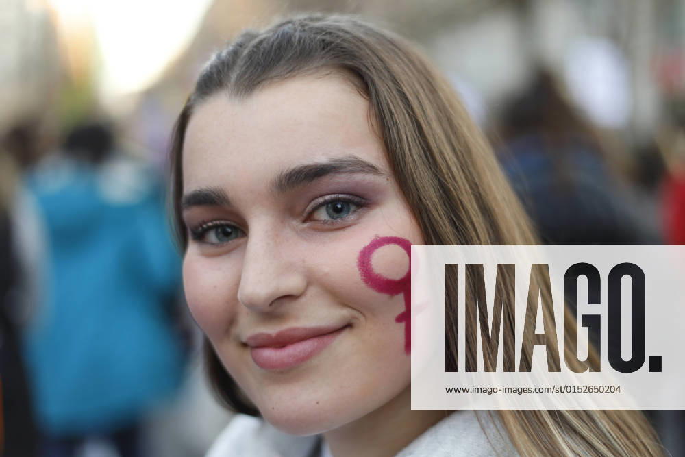 8M. Demonstration For Women s Day In Granada, Spain A girl smiles with a female symbol in her face during a demonstration in the International Women s Day in Granada on March 08, 2022. About 30,000 people, according to the Police, march through the streets of Granada (Spain) and recover the massive demonstration before the restrictions of the Covid pandemic. Granada Granada Spain