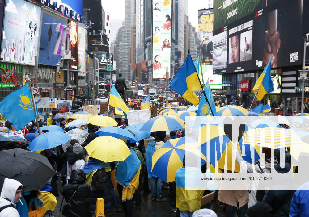 Protesters hold umbrellas with the colors of the flag of Ukraine at a Close the Sky March Umbrella Rally in support of Ukraine in Times Square in New York City on Saturday, March 12, 2022. The United Nations has recorded 1,581 civilian casualties since the start of the Russian invasion of Ukraine on Feb. 24. NYP20220312119 JohnxAngelillo