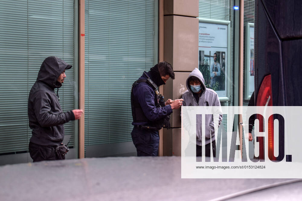 Greek Police detain irregular migrants without legal documents Greek Police officers inspect documents and detain irregular migrants without legal residence permit in the Aghios Panteleimonas area in central Athens, a district with high immigrant population. Athens Greece
