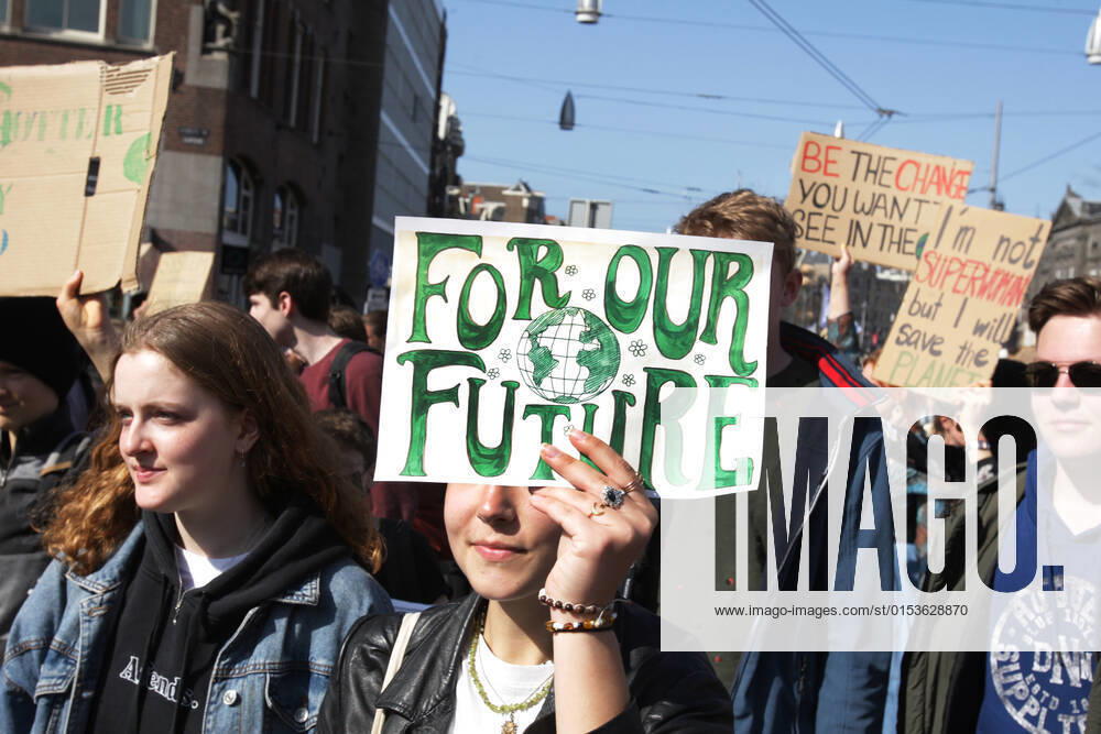 Young climate activists take part during Global Climate Strike march protest on March 25, 2022 in Amsterdam,Netherlands. Fridays For Future global climate strike protests brought hundreds of thousands of youth and supporters onto the streets in cities around the world to call for greater action from governments to tackle the climate crisis. Amsterdam Netherlands