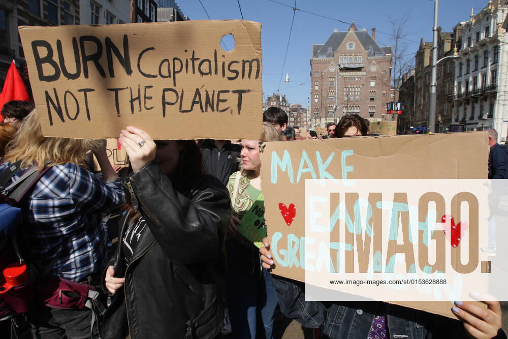 Young climate activists take part during Global Climate Strike march protest on March 25, 2022 in Amsterdam,Netherlands. Fridays For Future global climate strike protests brought hundreds of thousands of youth and supporters onto the streets in cities around the world to call for greater action from governments to tackle the climate crisis. Amsterdam Netherlands