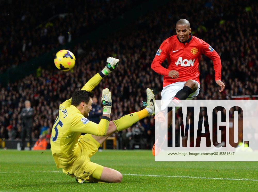 Hugo Lloris of Tottenham takes out Ashley Young of Manchester United but no penalty is given - Barclays Premier League - Manchester Utd vs Tottenham - Old Trafford Stadium - Manchester - England - 1st January 2014 - Picture Simon Bellis Sportimage .