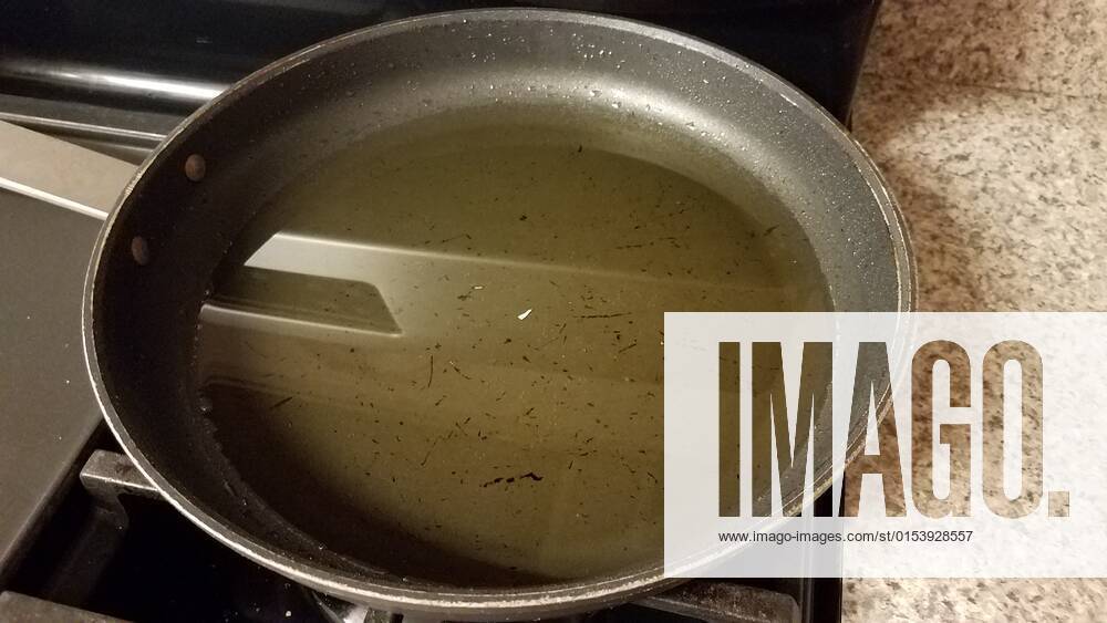 Dirty frying pan on stove with used cooking oil, model released, , property released, , 33851540.jpg, oil, used, skillet, frying pan, pan, oily, dirty, stove, kitchen, cooking, counter, greasy, liquid, grease, food