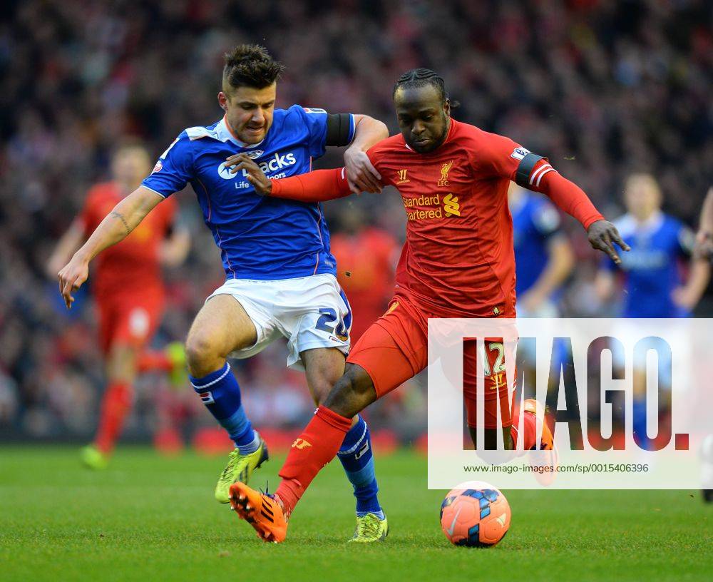 Mike Petrasso of Oldham Athletic challenges Victor Moses of Liverpool - The FA Cup with Budweiser 3rd Round - Liverpool FC vs Oldham Athletic - Anfield Stadium - Liverpool - England - 5th January 2014 - Picture SimonxBellis Sportimage .