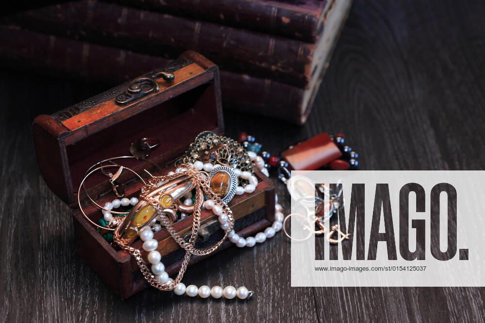Nice vintage open box full of various jewelry on dark wooden background, model released, , property released, , 14035940.jpg, Jewelry, Jewel, Jewelry Box, Treasure, Pearl, Adornment, Gold, Ring, Earring, Bracelet, Bangle, Necklace, Fashion, Female, Trinket, Personal Accessory, Beauty, Single Object, Nobody, Gem, Art, Craft, Shine, Diversity, Amber, Elegance, Stylish, Vintage, Retro, Inheritance, Legacy,