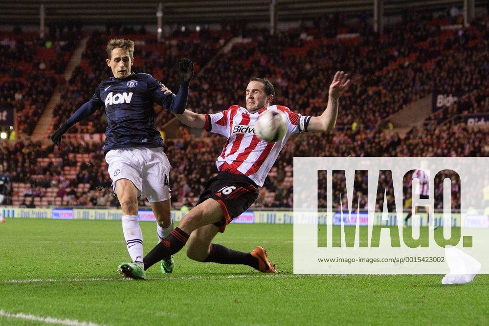John O Shea of Sunderland puts in a last minute challenge on Adnan Januzaj of Manchester United - AFC Sunderland vs. Manchester United (ManU) - Capital One Cup Semi Final First Leg - Stadium of Light - Sunderland - 07 01 2014 .