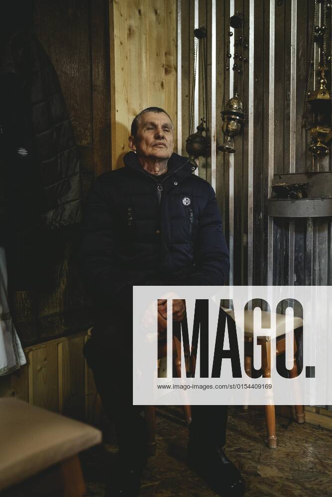 Stefan, 69, altar boy, served in the Soviet Union in the army, in the air defense, he says he knows the war, but is sure that Ukraine will win, young and old, women and men together and with Gods help, Putin is the devil, church in Pavliv, Ukraine, Europe