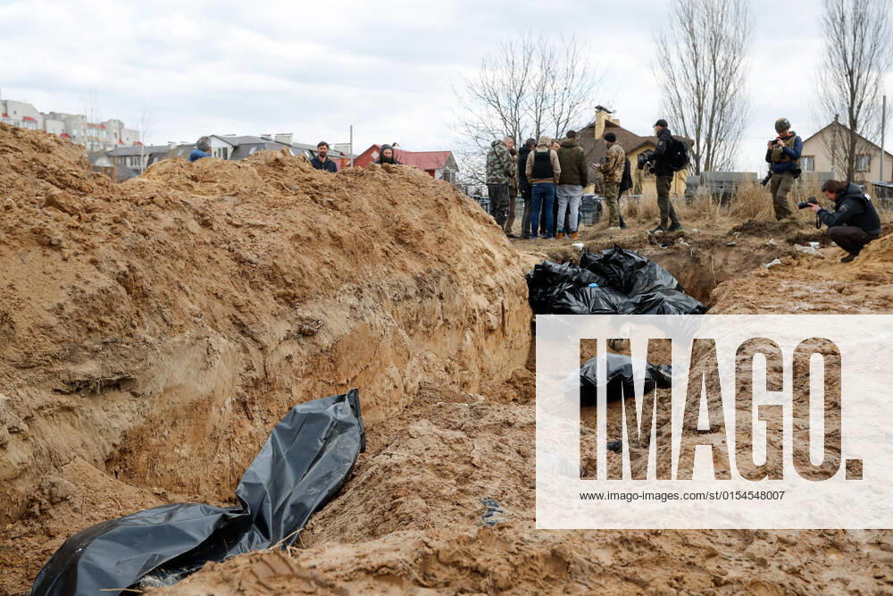 Dozens of corpses of Ukrainians are buried in a mass grave behind a church in Bucha, a town recently recaptured by the Ukrainian forces, as the Russian are said to have killed hundreds of civilians in the town. There have been International accusations of Russia committing war crimes since the beginning of the invasion of Ukraine. Bucha Ukraine - ZUMAs313 20220404_zip_s313_004