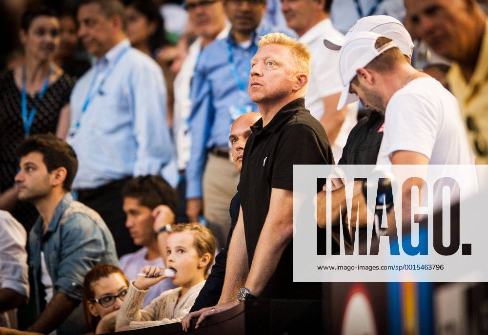 Jan. 13, 2014 - Melbourne, Victoria, Australia - Tennis legend Boris Becker - in black shirt -watches as his student - Novak Djokovic (SRB) in day one play of the 2014 Australian Open In Melbourne. 2014 Tennis - Australian Open - Day 1 - ZUMAkh1