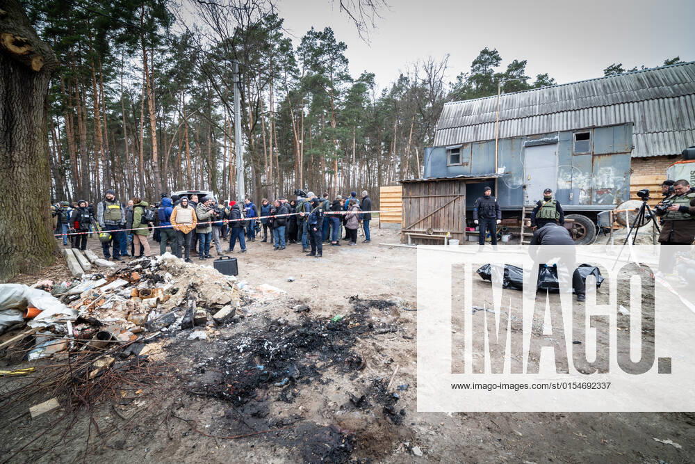 The remains of six Ukrainian people, four men and two women, one of whom was probably still a young and underage girl, was found in Bucha, outskirts of Kyiv, Ukraine. The soldiers of the Russian Federation shot four people, who subsequently poured flammable materials and set them on fire to destroy the traces of their crimes. Today, on April 5th, 2022, sa basic search of the crime scene and human remains was carried out. The bodies were then packed in bags and taken to a forensic forensic examination. Media representatives and journalists were invited to the site for a public demonstration of the horrors of the war perpetrated by the Russian Federation in Ukraine. (CTKxPhoto VojtechxDarvikxMaca) CTKPhotoF202204051260901