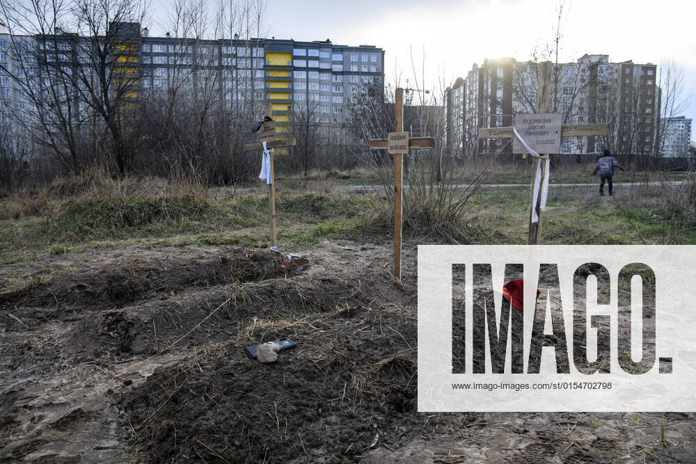 Graves with bodies of civilians, who according to local residents were killed by Russian soldiers in the town of Bucha, northwest of the Ukrainian capital Kyiv, on Monday. April 4, 2022. Ukraine and Western nations accused Russian troops of war crimes after the discovery of the mass graves and civilians who were apparently executed near Kyiv,. One rescue official said 57 people were found in one hastily dug trench behind a church. KYV2022040505 VladyslavxMusienko
