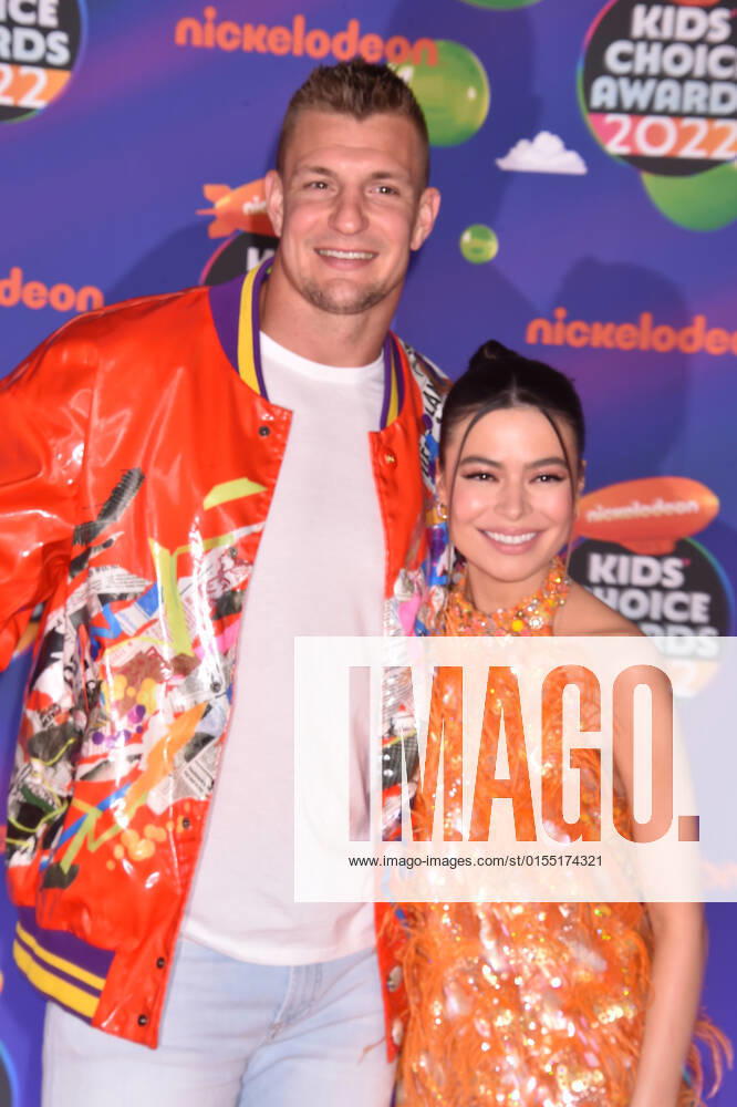 SANTA MONICA, CA - APRIL 9: Rob Gronkowski and Miranda Cosgrove at the 2022 Nickelodeon Kids Choice Awards at the Barker Hangar in Santa Monica, California on April 9, 2022.