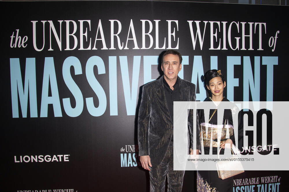 NICOLAS CAGE and his wife RIKO SHIBATA attend â€oeThe Unbearable Weight of Massive Talent†New York Premiere,.The Regal Essex Crossing, NYC.April 10, 2022. New York USA - ZUMAms4_ 20220410_zaf_ms4_013