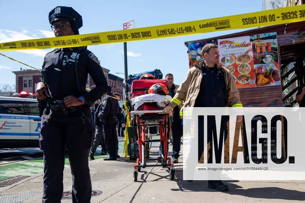 (220412) -- NEW YORK, April 12, 2022 -- First responders work at a nearby street after a shooting took place at a subway station in Brooklyn, New York, the United States, on April 12, 2022. At least five people were shot and 13 were injured on Tuesday morning at the subway station in Brooklyn, local media reported, citing law enforcement sources. (Photo by Michael Nagle Xinhua) U.S.-NEW YORK-SUBWAY STATION-SHOOTING WangxYing