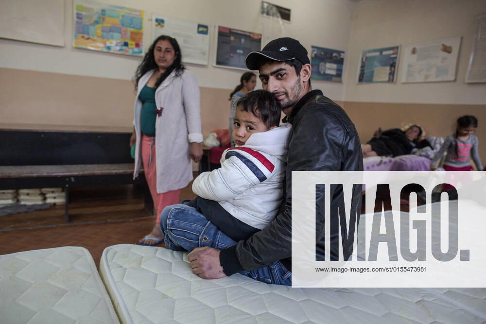 Roma man hugs his son inside the room where they take refuge after fleeing the conflict in Ukraine. The Roma people romanies, also known as gypsies are part of the 4 million people that have been displaced by violence from the armed conflict in Ukraine; placed in refugee aid centers in different parts of Moldova. They are generally organized and separated from other groups..There is no precise data, but according to organizations such as the Fundacion Secretariado Gitano, there are about 400,000 Romas living in Ukraine. Chisinau Moldova - ZUMAs197 20220408_zab_s197_062