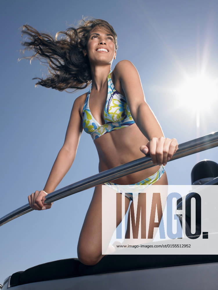 Happy Woman In Bikini Enjoying On Yacht, model released, , 10025864.jpg, Adult, Bikini, Blue, Boat, Boating, Bright, Brunette, Caucasian, Day, Enjoying, Enjoyment, Front View, Fun, Happiness, Happy, Leaning, Leisure, Lensflare, Lifestyle, Looking Away, Low Angle View, Luxury, Nautical, Nice, One, Outdoors, Person, Railing, Recreational, Sky, Smile, Smiling, Standing, Summer, Sunlight, Sunny, Swimwear, Tourism, Transportation, Travel, Vacation, Vertical, Vessel, Wind, Windswept, Woman, Women, Yacht, Young, 30s,