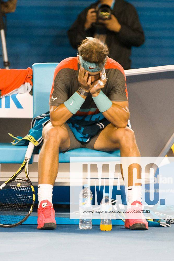 Jan. 26, 2014 - Melbourne, Victoria, Australia - January 26, 2014: 1st seed Rafael NADAL (ESP) rests after receiving treatment in the Men s Final on day 14 of the 2014 Australian Open grand slam tennis tournament at Melbourne Park in Melbourne, Australia. Sydney Tennis 2014: Australian Open JAN 26 - ZUMAc04