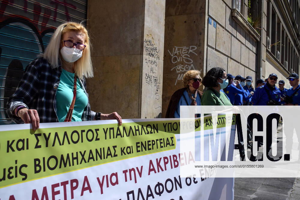 Greece: Thousands take to Athens streets in protest of price hikes A woman protests in front of the Ministry Of Development holding banner with slogans against soaring unbearable prices that plague Greek society. Athens Greece