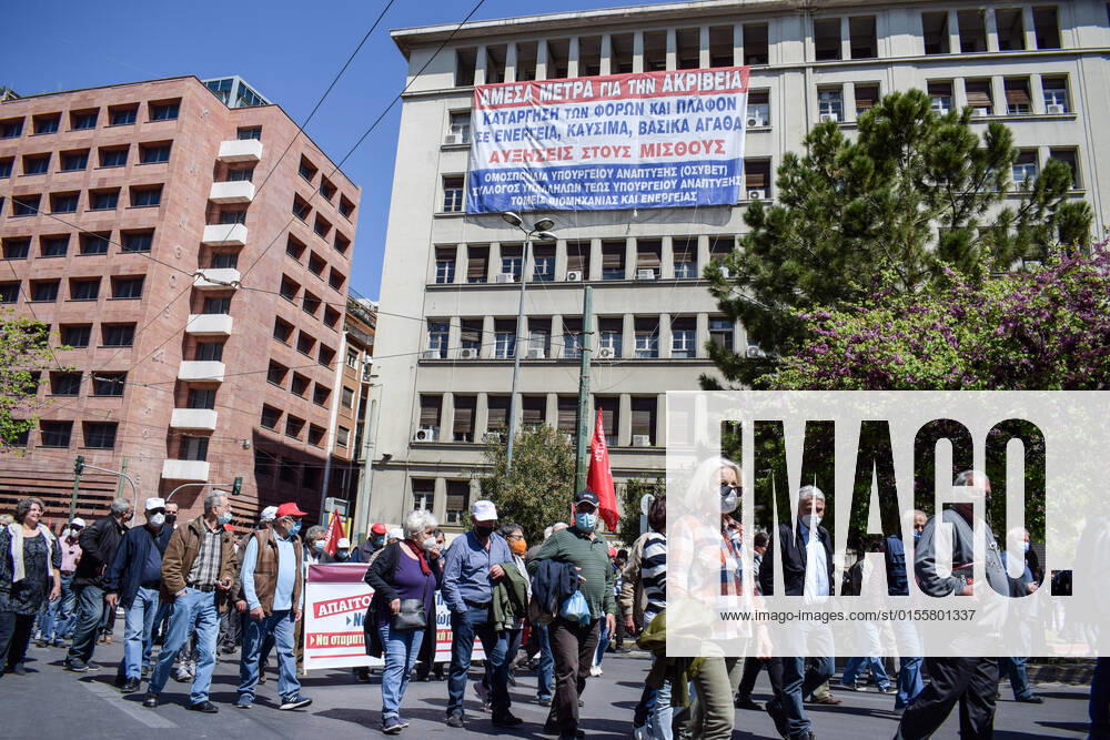 Greece: Thousands take to Athens streets in protest of price hikes Activists hang a giant banner in the facade of the Ministry of Development with slogans against price hikes while thousands protest in the streets. Athens Greece