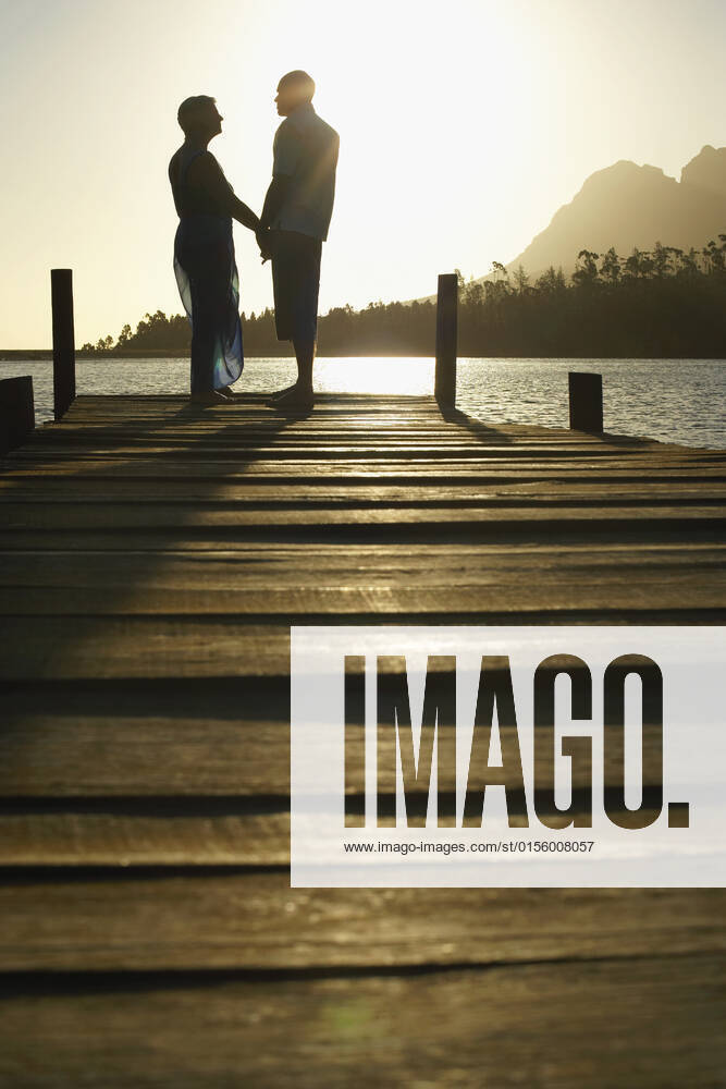 Senior Couple Standing On Edge Of Pier, model released, , property released, , 10007668.jpg, Adult, Baby Boomer, Backlit, Cape Town, Caucasian, Countryside, Couple, Dock, Edge, Enjoying, Female, Full Length, Happy, Holding Hands, Idyllic, Jetty, Lake, Leisure, Lourensford, Love, Male, Man, Men, Middle Age, Nature, Outdoors, People, Person, Pier, Recreation, Relaxation, Retirement, Rural, Scenic, Side View, Silhouette, South Africa, Standing, Summer, Sunlight, Sunset, Togetherness, Two, Vacation, Vertical, Weekend, Woman, Women, Wooden, 50s,