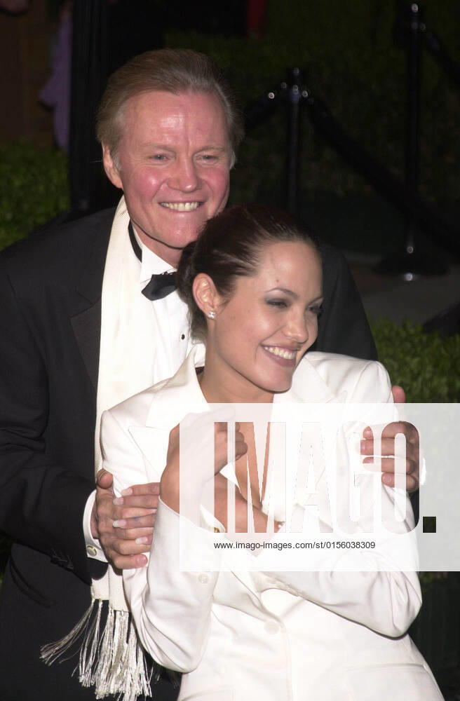 ANGELINA JOLIE and JON VOIGHT at the Vanity Fair Oscar Party, Mortons, West Hollywood, 03-25-01 , 10564366.jpg, couple, tuxedo, white, pullback, brunette, blonde, talent, fame, famous, star,