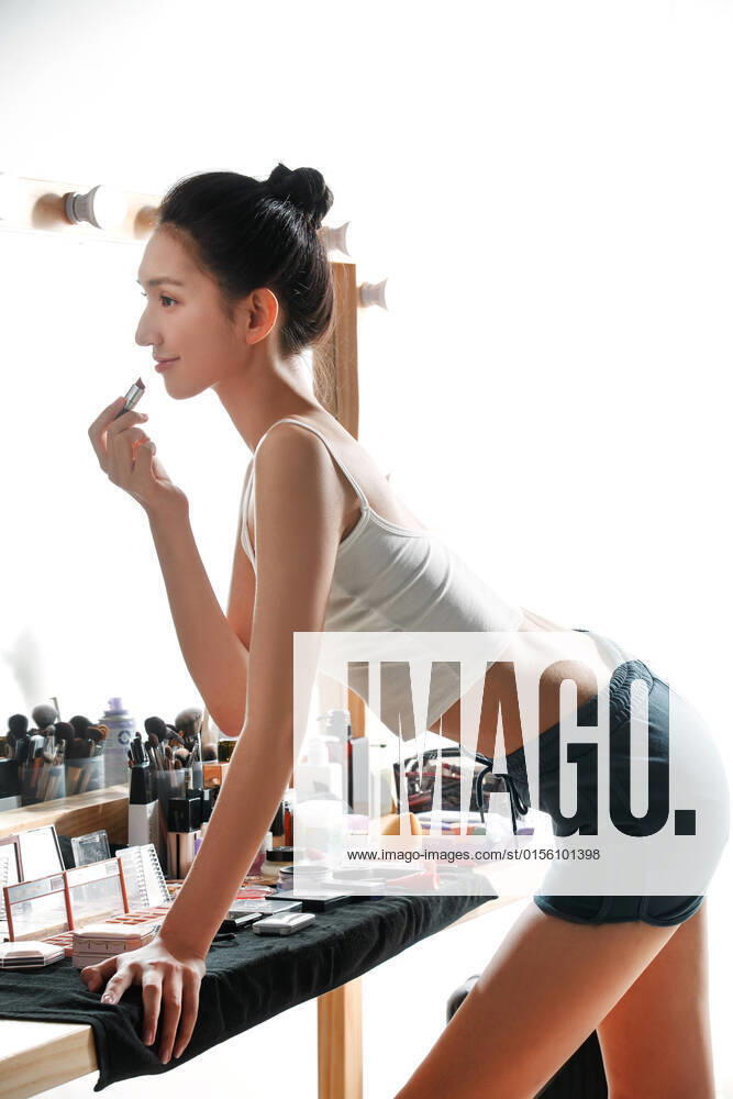 The young woman makeup in the dressing room China, 09 08 2021, model released,