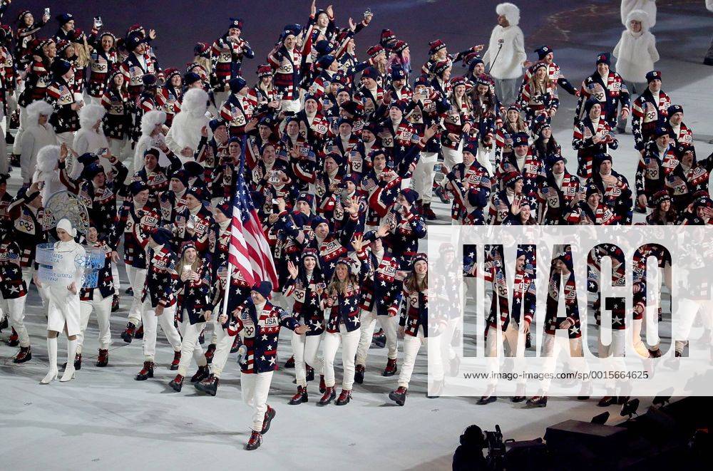 Feb. 7, 2014 - Sochi, RUS - Flag bearer Todd Lodwick and the USA team enters Fisht Olympic Stadium in Sochi, Russia, during the Opening Ceremony for the Winter Olympics, Friday, Feb. 7, 2014. Sochi Winter Olympics Opening Ceremony - ZUMAm67