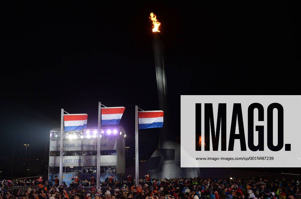 The flags of the Netherlands are raised during a victory ceremony after the Netherland s Sven Kramer, Jan Blokhuijsen and Jorrit Bergsma won gold, silver and bronze in the Men s 5000m Speed Skating event at the Sochi 2014 Winter Olympics on February 9, 2014 in Sochi. OLY20140209171
