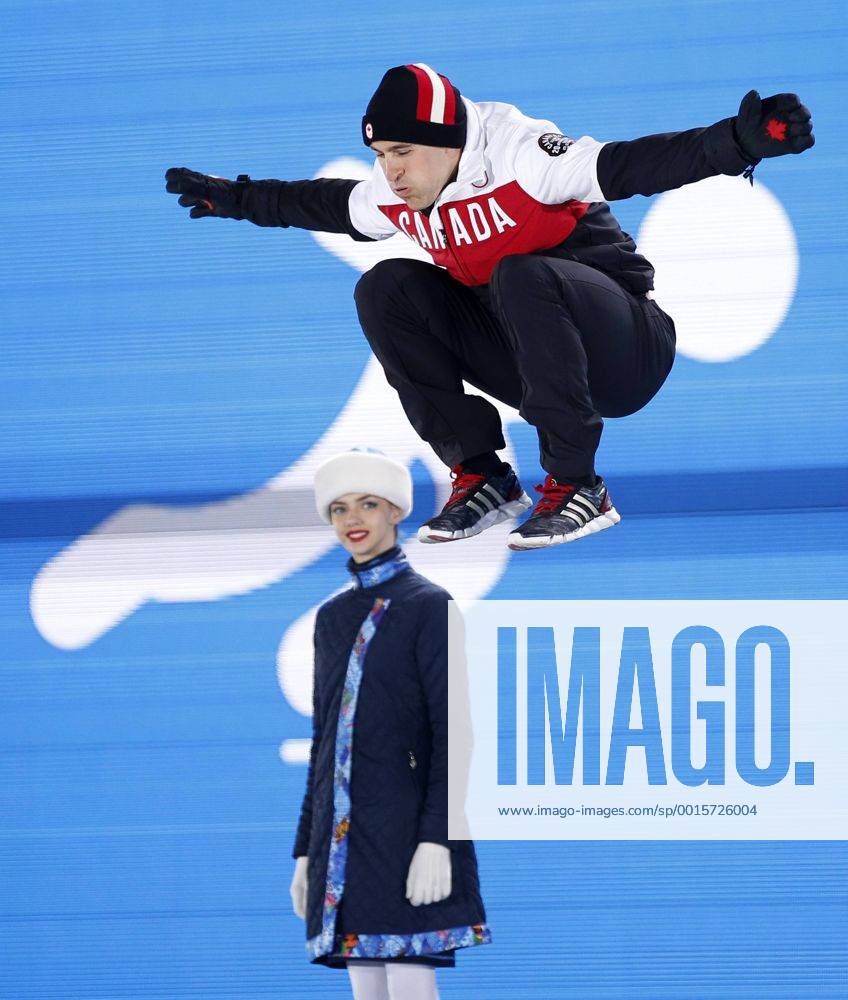 (140213) -- SOCHI, Feb. 13, 2014 (Xinhua) -- Silver medalist Denny Morrison (Top) of Canada jumps on the podium at the awarding ceremony for the Speed Skating Men s 1000m at the 2014 Sochi Winter Olympic Games in Sochi, Russia, Feb. 13, 2014. (Xinhua Wang Lili) (SP)OLY-RUSSIA-SOCHI-SPEED SKATING-MEN S 1000M