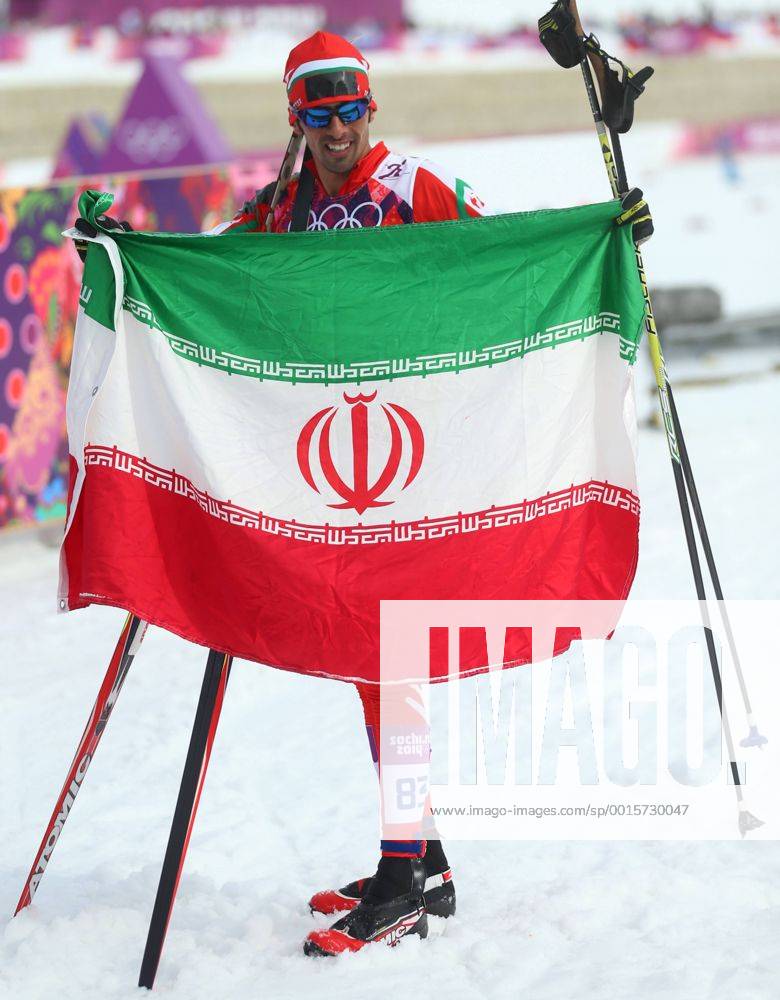 ITAR-TASS: SOCHI, RUSSIA. FEBRUARY 14, 2014. Skier Seyed Sattar Seyd of Iran holds his national flag after the men s cross-country 15 km classic event at the Laura Ski Centre at the 22nd Winter Olympic Games. premiumd kurios Aufmacher RE139461