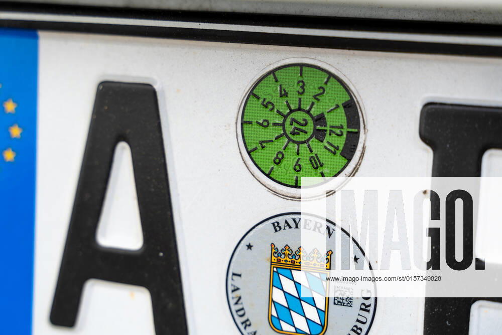 Bavaria, Germany - 25 April 2022: new TÜV sticker on a license plate, TÜV test mark on the car until 2024