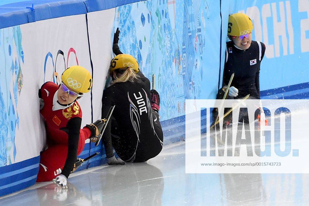Feb. 15, 2014 - Sochi, RUS - China s Alang Ki, (111), left, USA s Emily Scott (155), center, and Korea s Alang Kim (136), right, crash into the wall after colliding as they came out of a turn during the Ladies 1500 meter finals race at the Iceberg Skating Palace during the Winter Olympics in Sochi, Russia, Saturday, February 15, 2014. Ladies 1500 meter Short Track Speed Skating - ZUMAm67