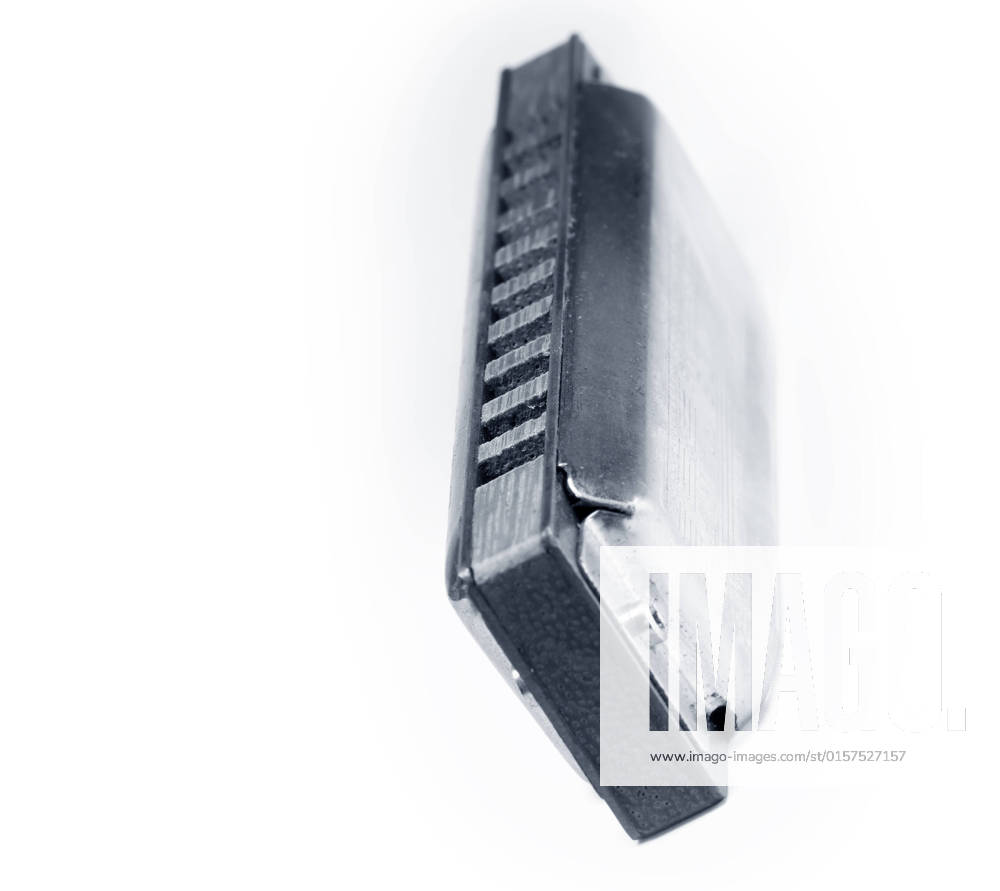Blues harmonica isolated on white background , 1691477.jpg, band, blow, blues, brass, country, diatonic, draw, folk, harmonica, harp, instrument, isolated, jazz, mouth, music, note, object, organ, plate, pop, reed, rock, metal, white, studio, vertical, toned,
