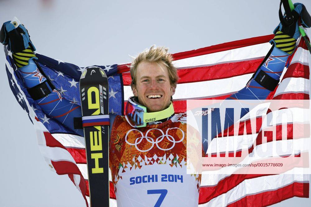Feb. 19, 2014 - Sochi, Russia - TED LIGETY of the USA holds up the national flag during the flower ceremony after winning the gold medal at the Men s Giant Slalom Rosa Khutor Alpine Center at the 2014 Sochi Winter Olympics. Men s Alpine - Sochi 2014 - ZUMA- S