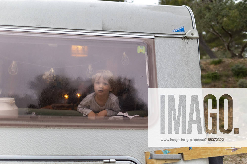 Child in rainy weather in a caravan Seget Vranjica Croatia