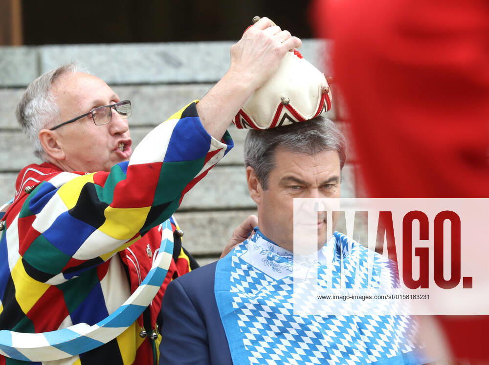 Traditional Schäfflertanz in the garden of the Bavarian State Chancellery Dr Markus Söder Soeder lets the Schäffler dance in the garden of the State Chancellery Markus Söder gets the fool cap put on, Munich Bavaria Germany garden of the State Chancellery