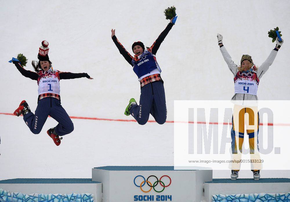 Feb. 21, 2014 - Sochi, Sochi, Russia - Canada s Marielle Thompson of Whistler, BC and Kelsey Serwa of Kelowna, BC jump of the podium after winning the gold and silver medals in Ski Cross at the Rosa Khutor Extreme Park in Sochi, Russia, on Friday February 21, also on the podium Anna Holmlund of Sweden 2014. Didier Debusschere Journal de Quebec Agence QMI OLY2014 Sochi Olympics - ZUMAq06