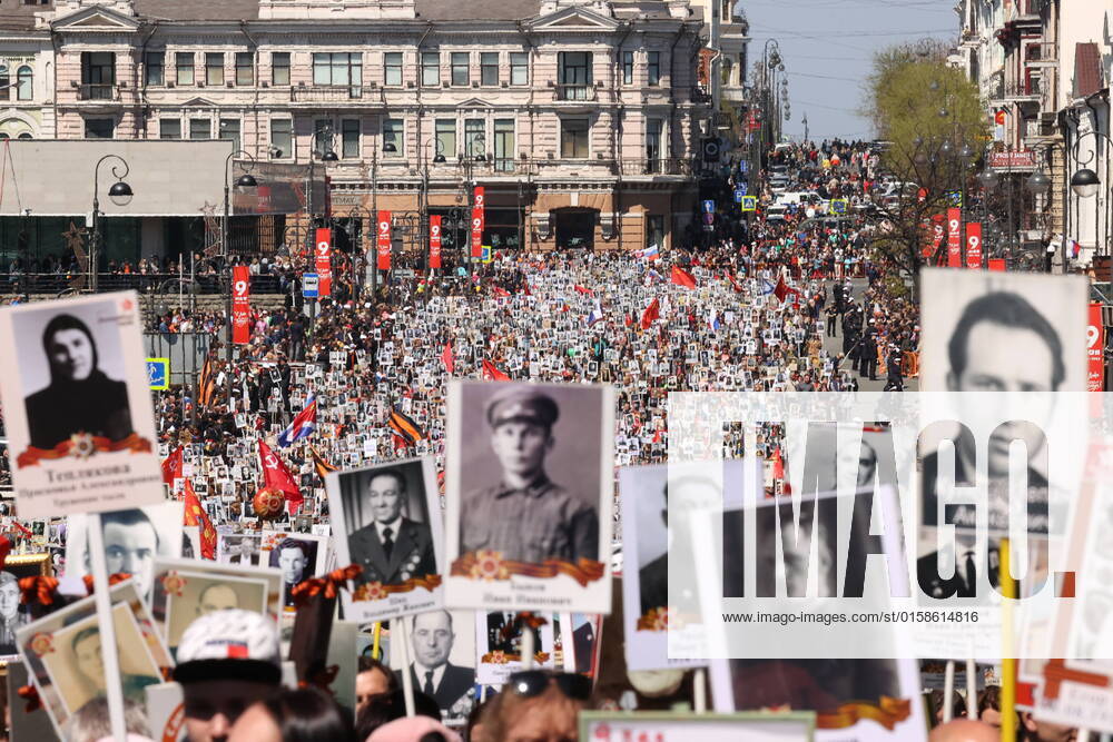 VLADIVOSTOK, RUSSIA – MAY 9, 2022: People holding photographs of their relatives who fought against Nazi Germany in WWII take part in an Immortal Regiment procession marking the 77th anniversary of Allied Victory in WWII. Yuri Smityuk TASS TS1304C4