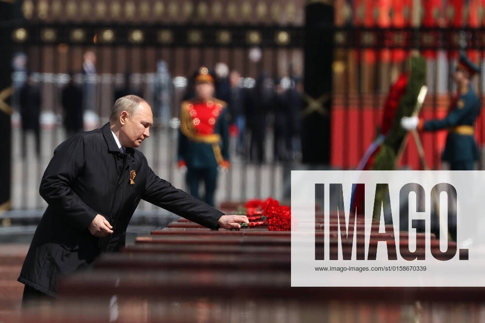 Russia s President Vladimir Putin lays flowers at a hero city stele in Moscow s Alexander Garden by the Kremlin Wall on the day of the 77th anniversary of the victory over Nazi Germany in World War II. Anton Novoderezhkin TASS TS130615