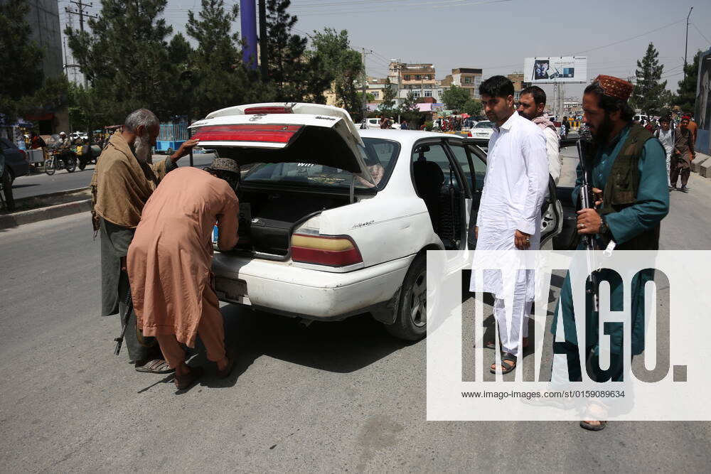 (220516) -- KABUL, May 16, 2022 -- Afghan security force members search a vehicle at a checkpoint in Kabul, Afghanistan, May 16, 2022. The Afghan National Police confiscated mass weapons and ammunition and arrested four people in three provinces in recent days, the country s Ministry of Interior said on Monday. (Photo by Xinhua) AFGHANISTAN-KABUL-CHECKPOINT SaifurahmanxSafi