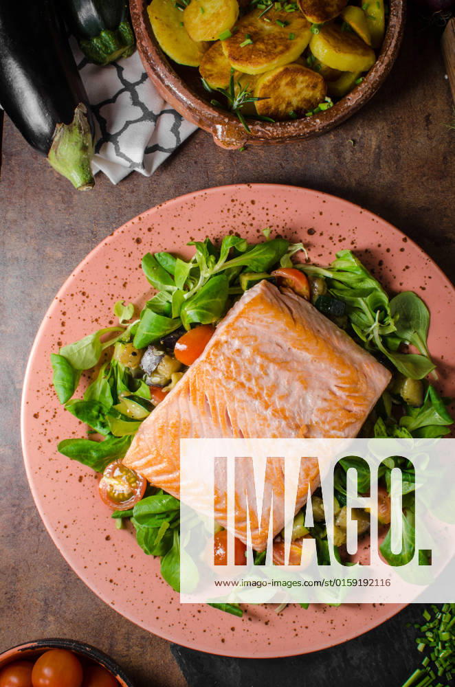 Salmon with roasted potatoes and mediterranean vegetables and salad , 22971808.jpg, salmon, grilled, fish, food, fillet, lemon, fresh, healthy, steak, closeup, board, gourmet, meal, herbs, slice, pepper, background, dinner, wooden, natural, seafood, raw, red, herb, filet, lunch, orange, sea, bbq, spice, cuisine, roasted, salt, green, white, omega, cedar, wild, grill, smoked, dill, roasted, potatoes, miditerranean, vegetable, salad, lamb lettuce, bio, organic, rustic,