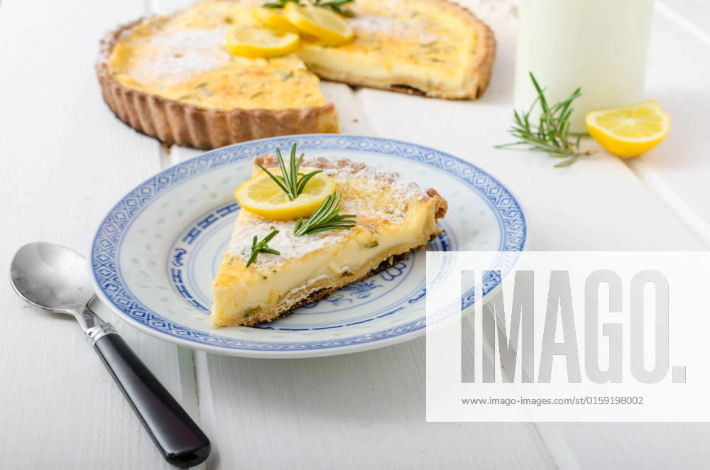 Lemon tart with rosemary, sweet quiche, milk and fresh herbs from garden , 23000496.jpg, lemon, tart, pie, cake, pastry, dessert, free, sweet, food, sugar, white, yellow, fresh, gluten, baked, fruit, plate, gourmet, background, citrus, snack, treat, crust, tasty, delicious, portion, cream, custard, restaurant, decoration, closeup, tarts, powdered, meal, slice, squares, round, piece, eat, rosemary, herbs, quiche, rustick, french, milk, microgreens, greens, board, wood, table,
