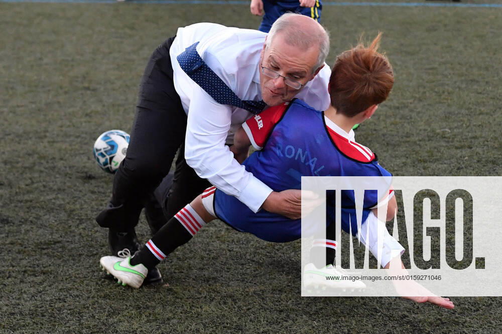 ELECTION22 SCOTT MORRISON ELECTION CAMPAIGN, Prime Minister Scott Morrison crash tackles a child at the Devonport Strikers Soccer Ground on Day 38 of the 2022 federal election campaign, in Devonport, in Tasmania. Wednesday, May 18, 2022. ( NO ARCHIVING, , NO USE IN BOOKS WITHOUT CONSENT DEVONPORT TAS AUSTRALIA