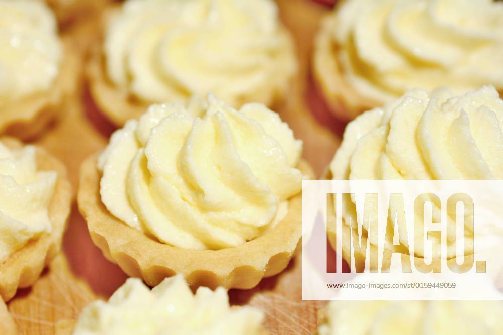 Closeup of cupcakes filled with vanilla cream. , 25100688.jpg, cream, cupcake, dessert, vanilla, cake, snack, background, food, cup, sweet, butter, confectionery, baked, celebration, delicious, swirl, birthday, decorating, decoration, epicure, treat, creamy, decorated, homemade, party, unhealthy, bakery, bakery goods, confection, cool, dairy, holiday, pudding, soft, twirl, buttercream, celebrate, fancy, nobody, cupcakes, frosting, icing,