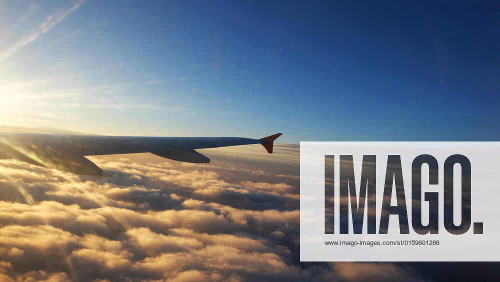 Wing of a Airplane at sunset with clouds. Travel, adventure, transport concept. View from the wing window at sunset. , 27241348.jpg, airplane, wing, plane, sky, sunset, view, sunrise, travel, aeroplane, nature, window, flight, aircraft, fly, vacation, high, air, cloud, transportation, transport, above, background, aviation, horizon, aerial, airline, skyline, trip, jet, atmosphere, beautiful, blue, sun, white, scenic, journey, top, cloudy, cloudscape, space, day, over, light, tourism, holiday, bright, technology, set, sunny, flying,