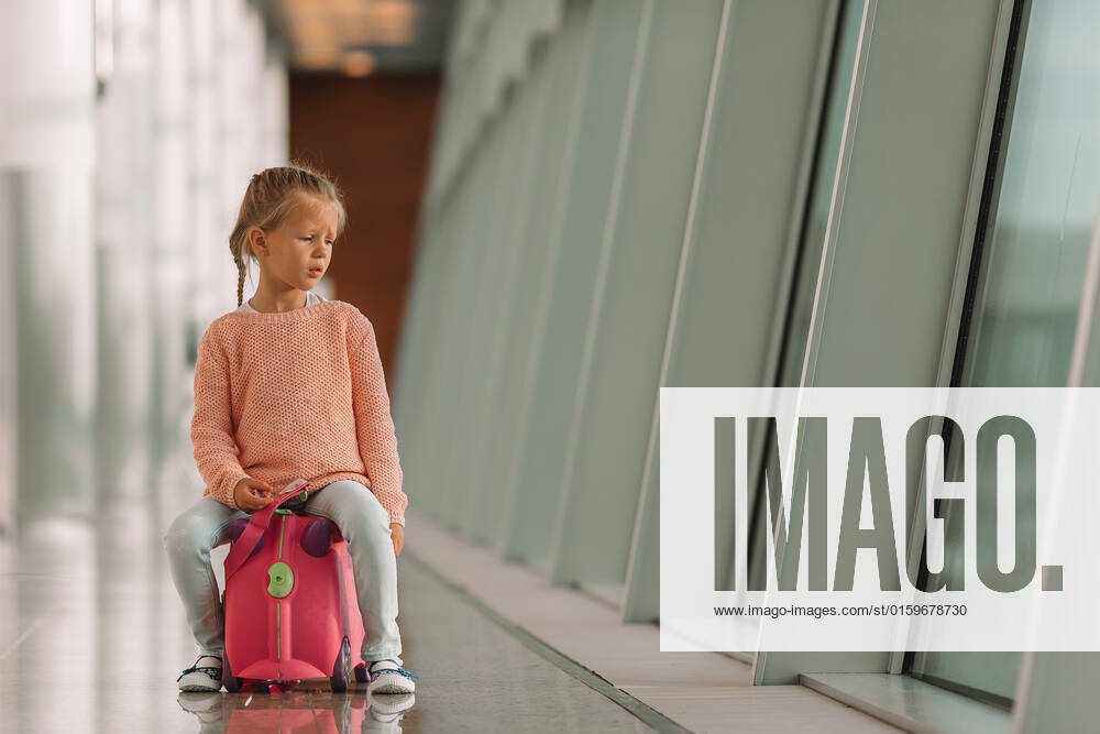 Adorable little girl at airport sitting on suitcase in big international airport near window, model released, , 30432682.jpg, airport, kid, adventure, waiting, ride, plane, enjoy, child, travel, pink, girl, fun, leisure, departure, casual, indoor, hall, one, caucasian, cute, tourist, baggage, small, transport, lifestyle, young, luggage, suitcase, passenger, terminal, adorable, voyage, person, childhood, inside, airline, tourism, trip, cheerful, beautiful, bag, arrival, flight, vacation, little, journey, funny, passport, boarding pass,